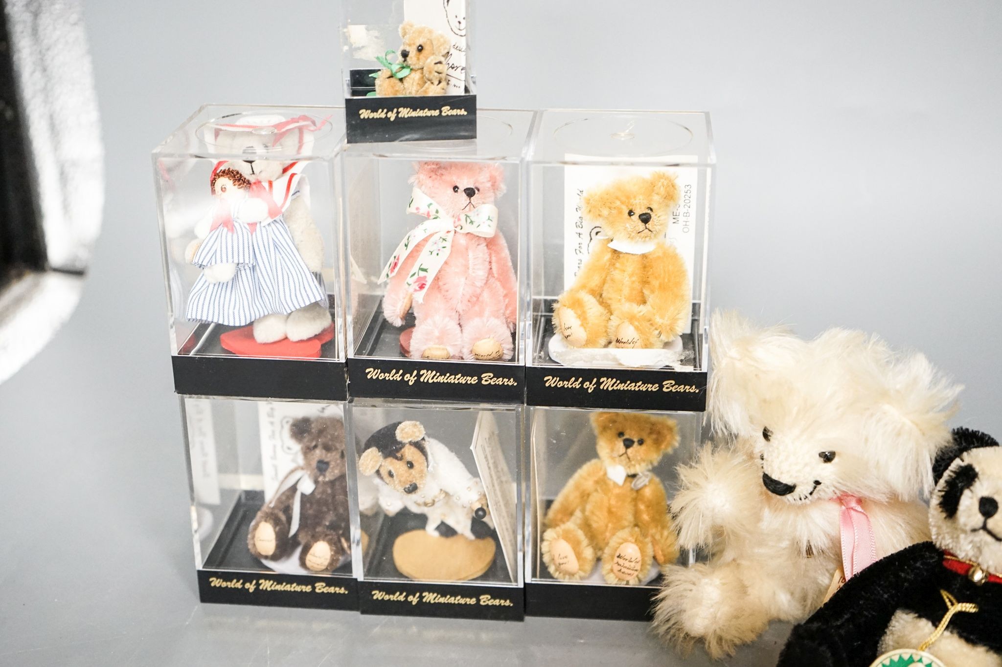 Seven World of Miniature Bears and one Grisley and one Herman